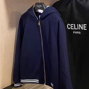 Celine's color-coordinated hooded zipper coat in navy blue